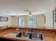 Spacious kitchen with stainless steel sink overlooking the bright living area at 564 Mount Olympus Blvd, New Smyrna Beach, FL 32168