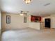 Open concept living space includes a view of the kitchen, with a breakfast bar at 564 Mount Olympus Blvd, New Smyrna Beach, FL 32168