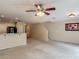 Open concept area shows living room and kitchen, and the staircase leading to the second floor at 564 Mount Olympus Blvd, New Smyrna Beach, FL 32168