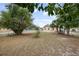 Large backyard with trees surrounding home at 566 S Floyd Cir, Deltona, FL 32725
