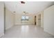 Bright living room with tile flooring, neutral walls, and a welcoming front entrance at 566 S Floyd Cir, Deltona, FL 32725