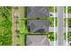 Aerial view showing the property's layout with solar panels, including a defined yard space and neighborhood context at 6212 W Fallsgrove Ln, Port Orange, FL 32128