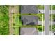 Aerial view showing the property's layout with solar panels, including a defined yard space and neighborhood context at 6212 W Fallsgrove Ln, Port Orange, FL 32128
