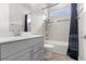 Bright bathroom showcasing a modern vanity, tub, a single window, and neutral wall tile at 6212 W Fallsgrove Ln, Port Orange, FL 32128