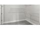 Walk-in closet with white wire shelving and gray carpet at 6212 W Fallsgrove Ln, Port Orange, FL 32128
