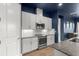 Modern kitchen features stainless appliances, granite countertops, white cabinets and subway tile backsplash at 6212 W Fallsgrove Ln, Port Orange, FL 32128