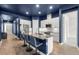 Modern kitchen featuring granite countertops, white cabinets, pendant lights, and stainless steel appliances at 6212 W Fallsgrove Ln, Port Orange, FL 32128