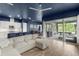 Open-concept living area featuring wood floors, a modern kitchen, and sliding glass doors to patio at 6212 W Fallsgrove Ln, Port Orange, FL 32128