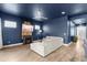 Open-concept living area featuring wood floors, a fireplace, and views of the screened-in patio at 6212 W Fallsgrove Ln, Port Orange, FL 32128