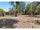 Spacious backyard featuring a shed, basketball hoop, and pergola, offering room for activities at 632 Tarragona Way, Daytona Beach, FL 32114