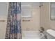 Bathroom highlighting a well-maintained bathtub with shower and classic tiled walls at 632 Tarragona Way, Daytona Beach, FL 32114