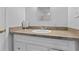 Bathroom vanity with a neutral countertop, white sink, and decorative mirror at 632 Tarragona Way, Daytona Beach, FL 32114