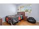 Bedroom showcasing a single bed with stylish bedding and a cozy beanbag chair at 632 Tarragona Way, Daytona Beach, FL 32114
