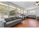 Bright living room featuring hardwood floors and a large window for natural light at 632 Tarragona Way, Daytona Beach, FL 32114