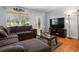 Cozy living room with hardwood floors, natural light, and a comfortable sectional sofa at 632 Tarragona Way, Daytona Beach, FL 32114