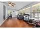 Bright living room featuring hardwood floors and recreational equipment for in-home activities at 632 Tarragona Way, Daytona Beach, FL 32114