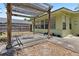 Covered pergola on the backyard patio with exercise equipment, ideal for outdoor workouts at 632 Tarragona Way, Daytona Beach, FL 32114