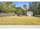 The spacious backyard features a shed and a tree at 6509 Lake Lerla Dr, Apopka, FL 32712