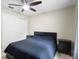 Comfortable bedroom featuring a ceiling fan, closet space, and neutral walls at 6509 Lake Lerla Dr, Apopka, FL 32712