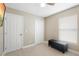 Bedroom with large and small closets, plus a bench at 6509 Lake Lerla Dr, Apopka, FL 32712