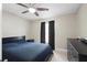 Cozy bedroom featuring a ceiling fan, natural light, and neutral walls at 6509 Lake Lerla Dr, Apopka, FL 32712