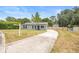 Charming single-story home with a long driveway and privacy fence at 6509 Lake Lerla Dr, Apopka, FL 32712
