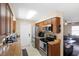 Well-equipped kitchen with granite countertops, stainless steel appliances, and wood cabinets at 6509 Lake Lerla Dr, Apopka, FL 32712