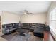 Spacious living room features a comfortable black sectional sofa and a large rug at 6509 Lake Lerla Dr, Apopka, FL 32712
