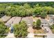 Aerial view of the homes in the neighborhood featuring mature trees and lush landscapes at 680 Preakness Cir, Deland, FL 32724