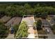An aerial of the homes in the neighborhood featuring mature trees, lush landscaping and outlined property at 680 Preakness Cir, Deland, FL 32724