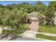 Charming home boasts a well-maintained lawn, and a brick-paved driveway at 680 Preakness Cir, Deland, FL 32724