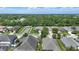 Aerial view of a neighborhood showcasing well-maintained homes, green lawns, mature trees, and quiet streets at 6820 Vintage Ln, Port Orange, FL 32128