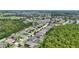 Aerial view of a neighborhood showcasing homes, green spaces, lakes, and winding streets, creating a picturesque community at 6820 Vintage Ln, Port Orange, FL 32128