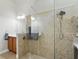 Bright bathroom featuring a walk-in shower with glass enclosure and updated fixtures at 6820 Vintage Ln, Port Orange, FL 32128