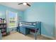 bedroom features a blue loft bed with a built-in desk and plenty of space for storage at 6820 Vintage Ln, Port Orange, FL 32128