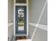 Welcoming front door featuring a decorative wreath and a clear glass window at 6820 Vintage Ln, Port Orange, FL 32128