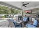 Outdoor patio area with a grill, TV, and seating area at 6820 Vintage Ln, Port Orange, FL 32128