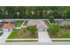 An aerial view of the property showcasing its layout, landscaping, fenced yard and neighborhood at 703 Elkhorn Fern Ln, Deland, FL 32720