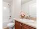 Bathroom featuring a tub-shower combo and single sink vanity at 703 Elkhorn Fern Ln, Deland, FL 32720