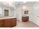 Bathroom featuring double vanities with granite countertops, tile flooring, and ample space at 703 Elkhorn Fern Ln, Deland, FL 32720