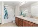 Bathroom with double vanity, tub-shower combo, and neutral color scheme at 703 Elkhorn Fern Ln, Deland, FL 32720