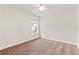 Bright bedroom with a window and neutral carpet, creating a peaceful and inviting space at 703 Elkhorn Fern Ln, Deland, FL 32720