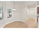 Bright breakfast nook area features large window, neutral walls, and tile floor at 703 Elkhorn Fern Ln, Deland, FL 32720