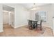 This dining room includes a chandelier, a table with seating for four, and natural light at 703 Elkhorn Fern Ln, Deland, FL 32720