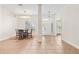 Elegant dining room with chandelier, tile flooring and large front window at 703 Elkhorn Fern Ln, Deland, FL 32720