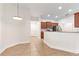 Open floor plan from eat-in area into the kitchen, stainless appliances, and breakfast bar at 703 Elkhorn Fern Ln, Deland, FL 32720