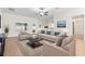 Inviting living room featuring neutral tones, comfortable seating, and lots of natural light at 703 Elkhorn Fern Ln, Deland, FL 32720