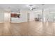 Open concept living and dining area with a view to the kitchen at 703 Elkhorn Fern Ln, Deland, FL 32720