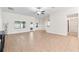 Spacious open floor plan showcasing tile flooring, neutral paint, and natural light at 703 Elkhorn Fern Ln, Deland, FL 32720