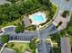 Aerial view of condos and community pool area with parking lot at 783 Shropshire Loop, Sanford, FL 32771